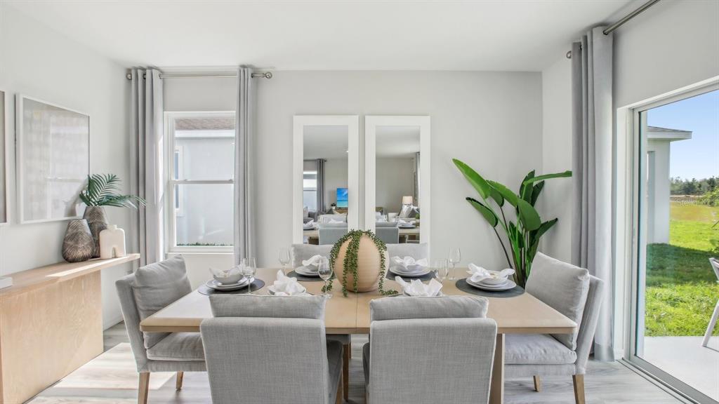 35293 Vly Rdg Road Dade City, FL 33525 - Photo 8 of 36 a dining room with furniture and wooden floor