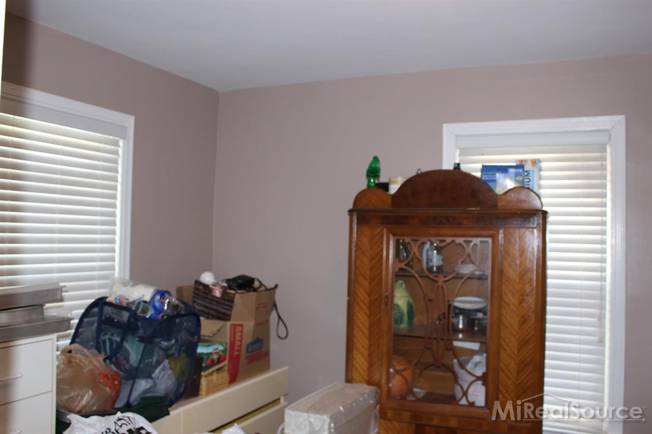 2936 Harvey Street Rochester, MI 48309 - Photo 16 of 29 This is the 3rd bedroom on the first floor. This bedroom has stairs which lead to the attic for even more storage!!