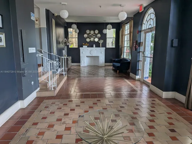 a view of lobby with window and furniture