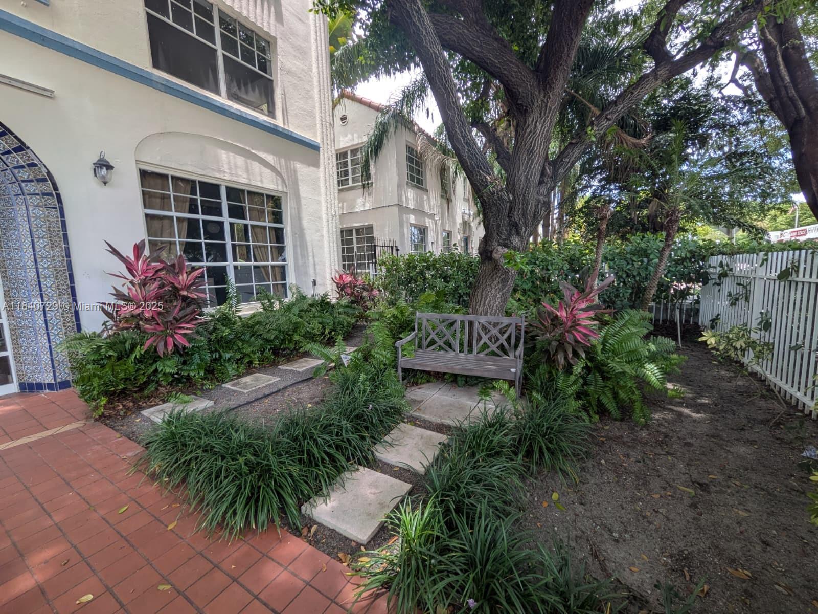 1008 Jefferson Avenue, Unit 202 Miami Beach, FL 33139 - Photo 3 of 16 a view of a house with a yard and flower plants