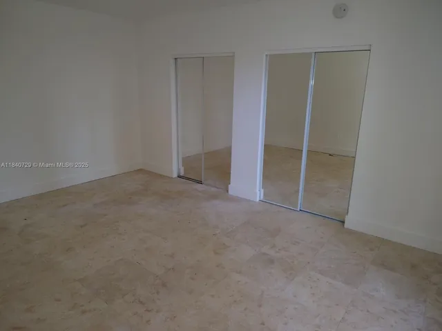 an empty room with closet
