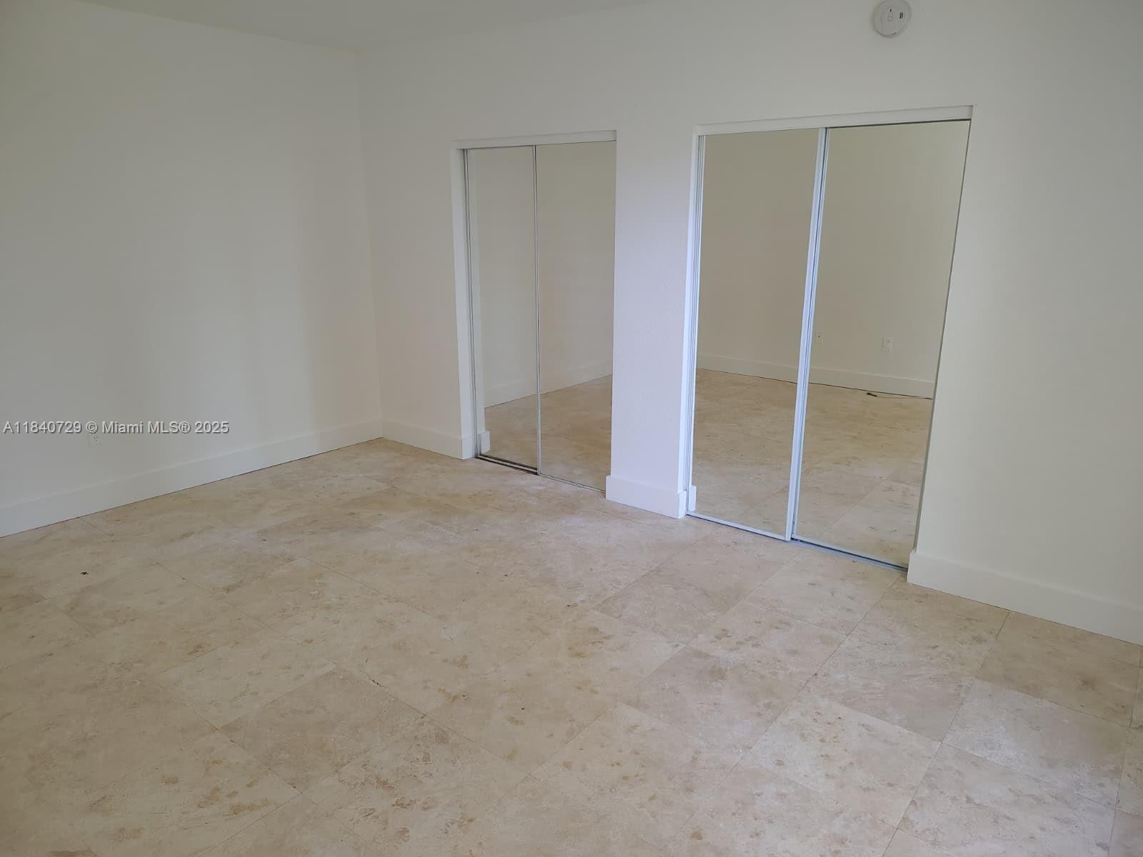 1008 Jefferson Avenue, Unit 202 Miami Beach, FL 33139 - Photo 10 of 16 an empty room with closet area