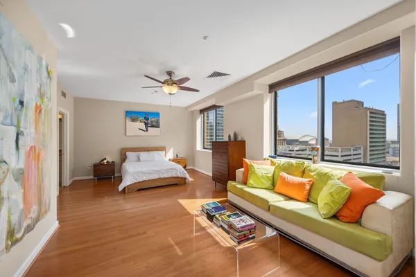a living room with furniture and a large window