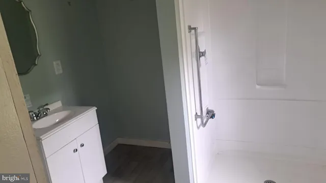 a bathroom with a sink a vanity and a mirror