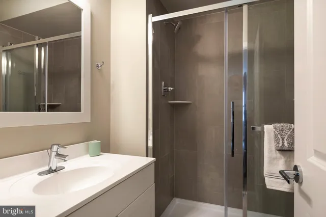 a bathroom with a sink and mirror