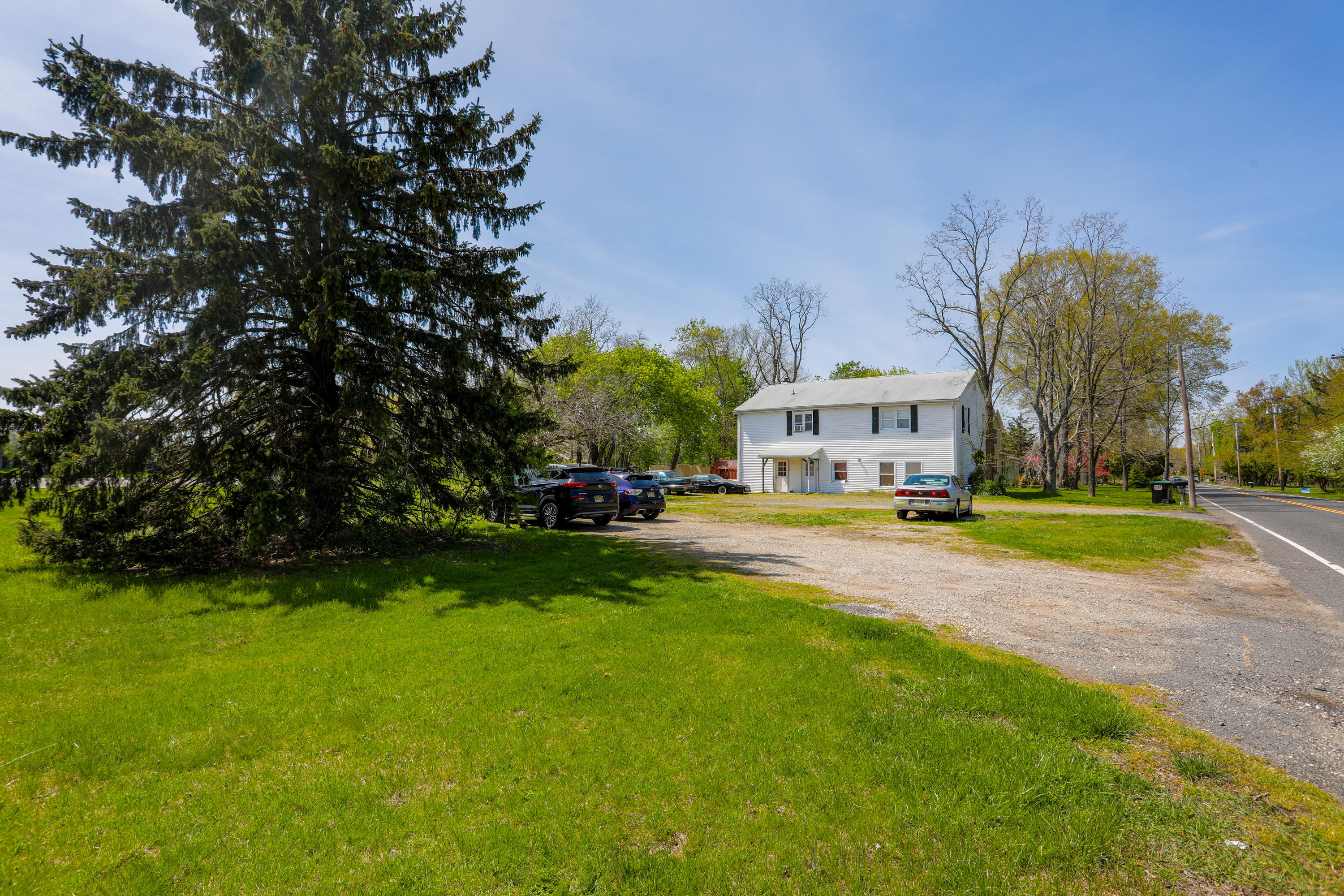 511 Squankum Yellowbrook Road Farmingdale, NJ 07727 - Photo 22 of 27 a view of street with houses and trees in the background