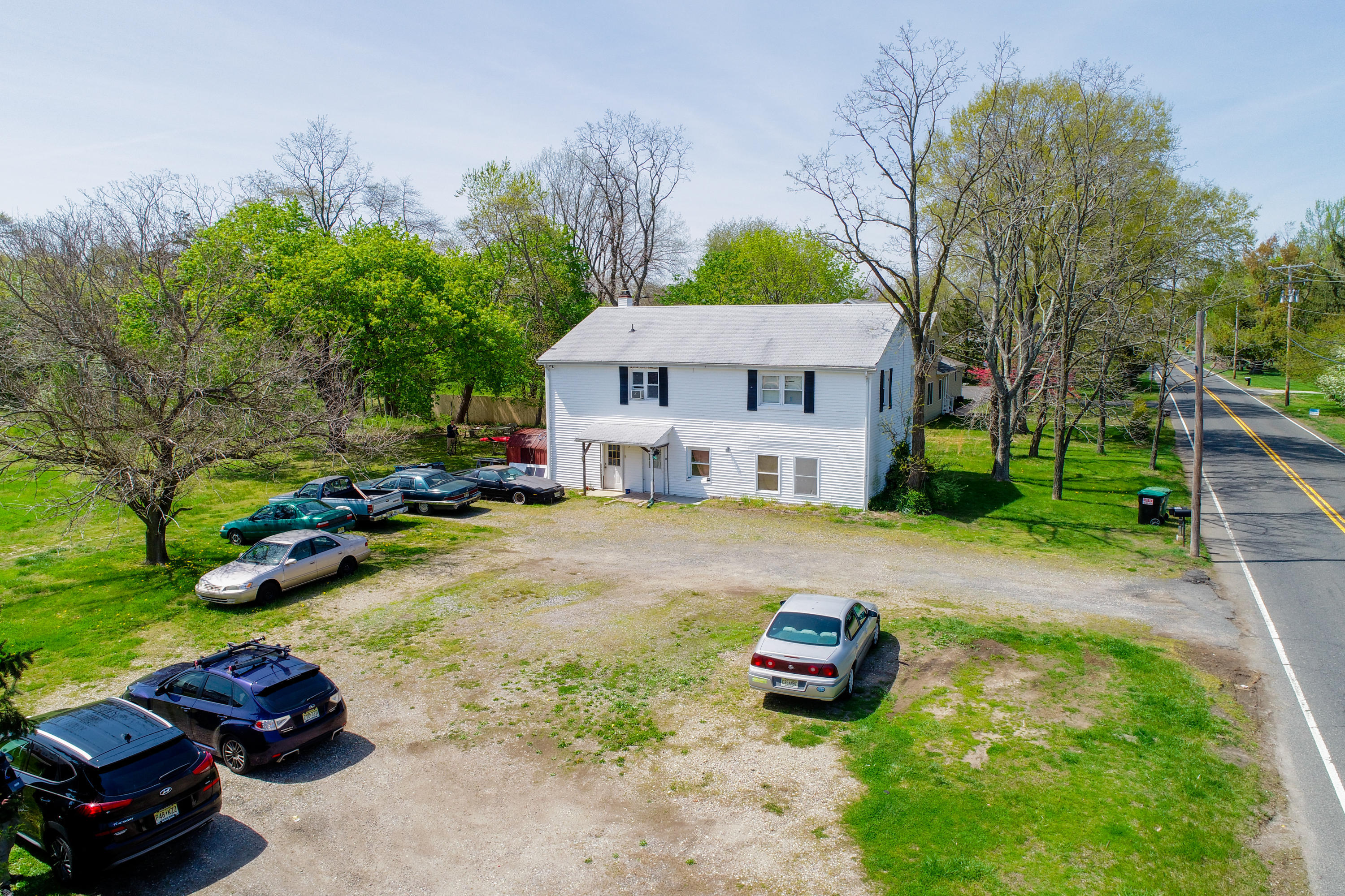 511 Squankum Yellowbrook Road Farmingdale, NJ 07727 - Photo 7 of 27 a view of a house with swimming pool and sitting area