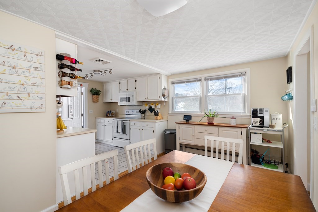 3 Athens Drive Saugus, MA 01906 - Photo 13 of 36 a kitchen with stainless steel appliances a stove a sink and white cabinets