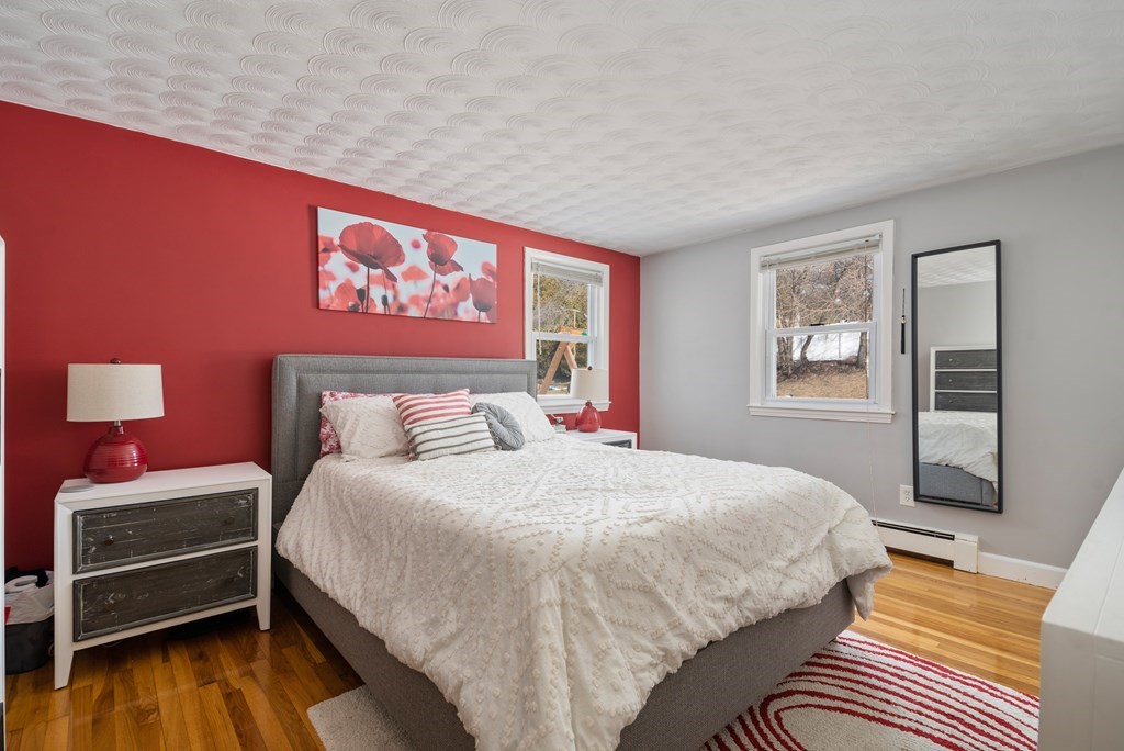 3 Athens Drive Saugus, MA 01906 - Photo 16 of 36 a bedroom with a bed and wooden floor