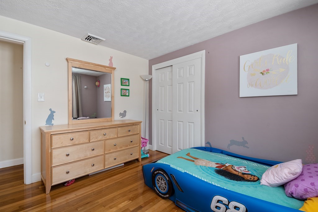 3 Athens Drive Saugus, MA 01906 - Photo 21 of 36 a bed room with a bed and a dresser