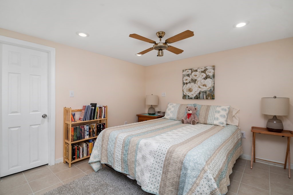 3 Athens Drive Saugus, MA 01906 - Photo 28 of 36 a bedroom with a bed and a book shelf
