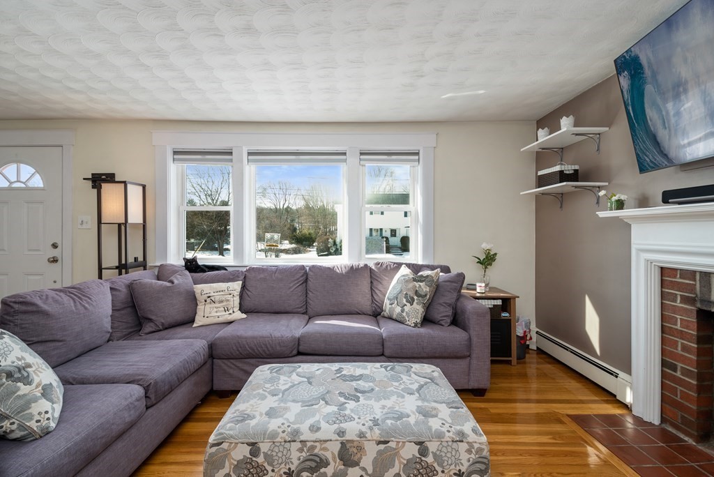 3 Athens Drive Saugus, MA 01906 - Photo 6 of 36 a living room with furniture and a fireplace