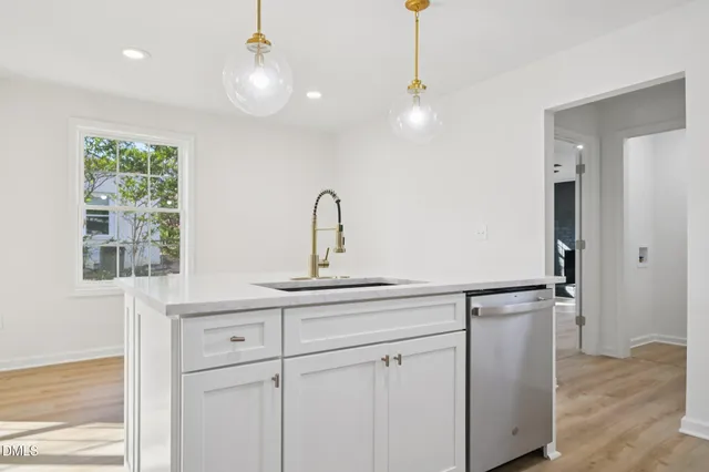 a kitchen with stove and refrigerator