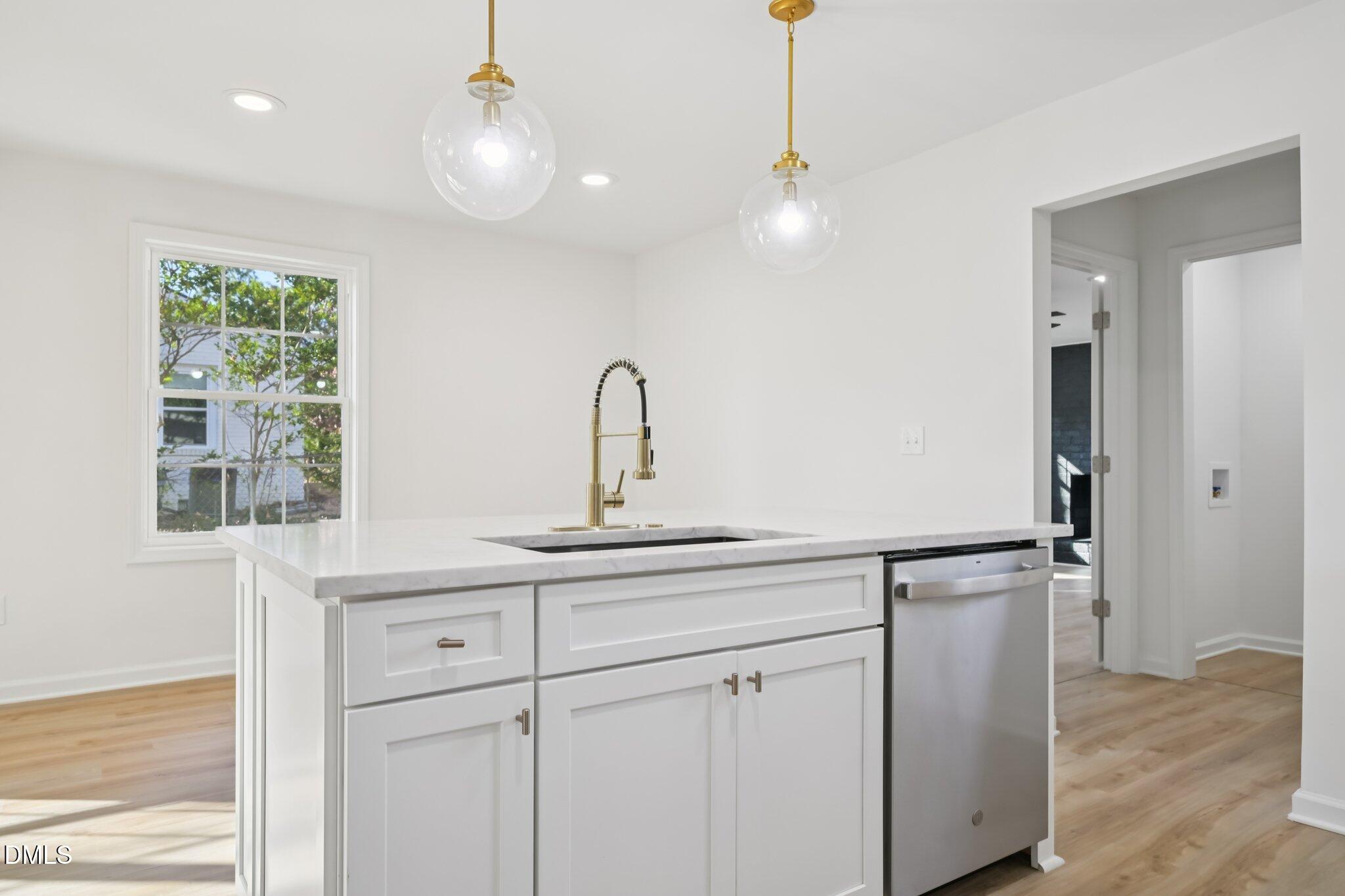 2343 Derby Drive Raleigh, NC 27610 - Photo 12 of 38 a kitchen with a sink and cabinets