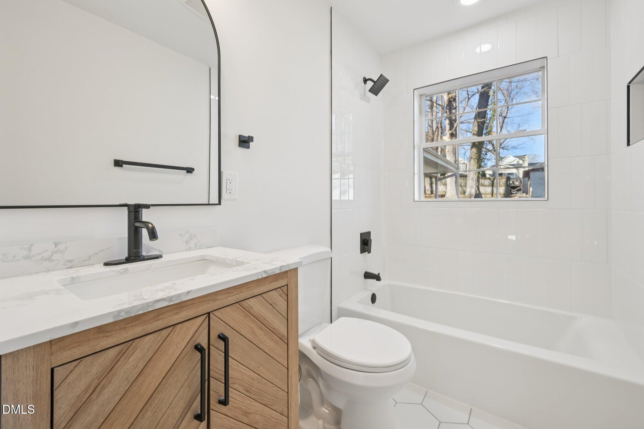 2343 Derby Drive Raleigh, NC 27610 - Photo 17 of 38 a bathroom with a sink toilet and shower