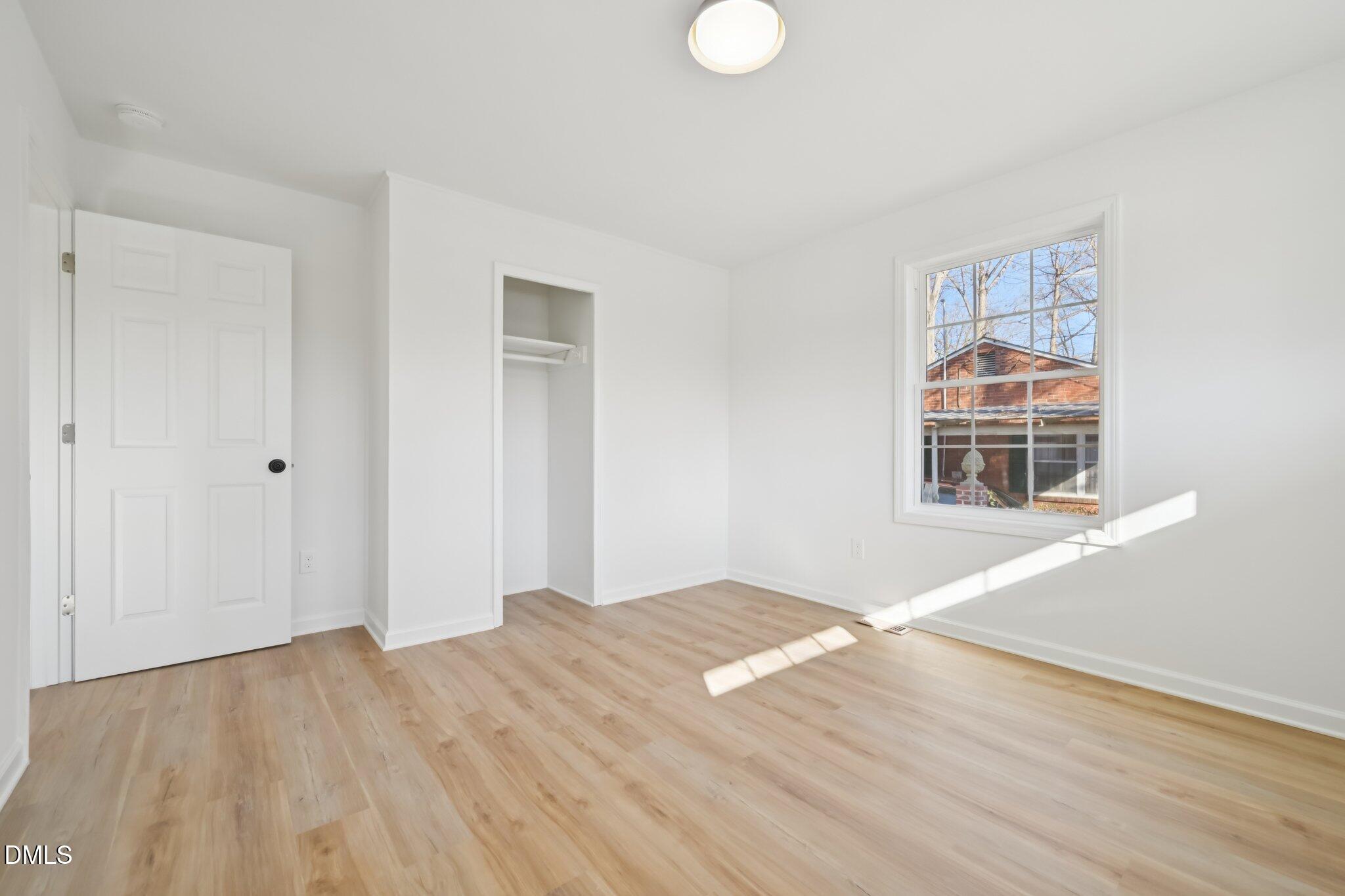 2343 Derby Drive Raleigh, NC 27610 - Photo 25 of 38 a view of a room with wooden floor and window