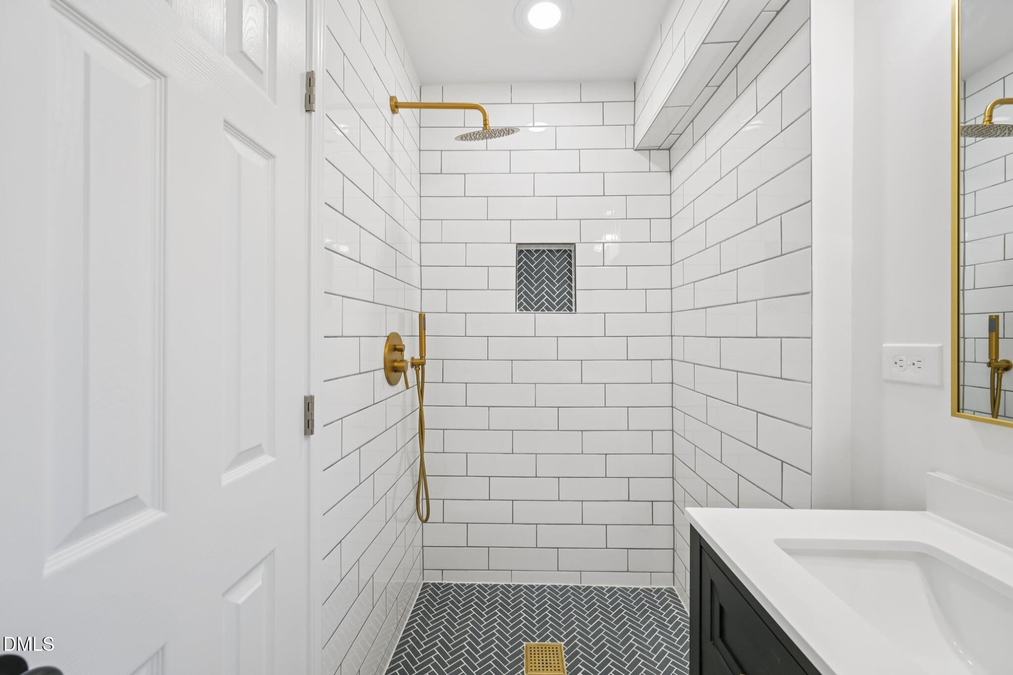 2343 Derby Drive Raleigh, NC 27610 - Photo 27 of 38 a bathroom with a sink and a shower