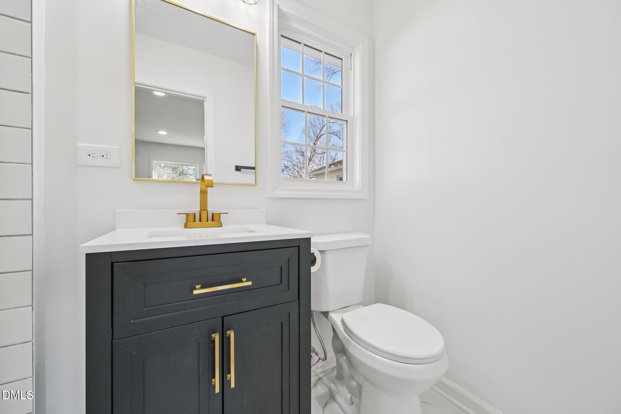 2343 Derby Drive Raleigh, NC 27610 - Photo 28 of 38 a bathroom with a sink and a toilet