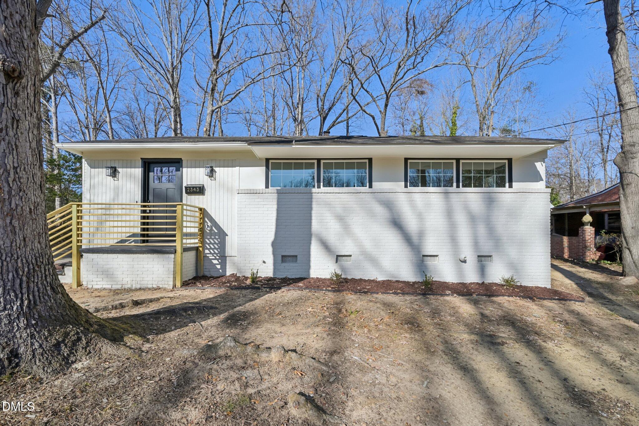 2343 Derby Drive Raleigh, NC 27610 - Photo 2 of 38 a front view of a house with a yard