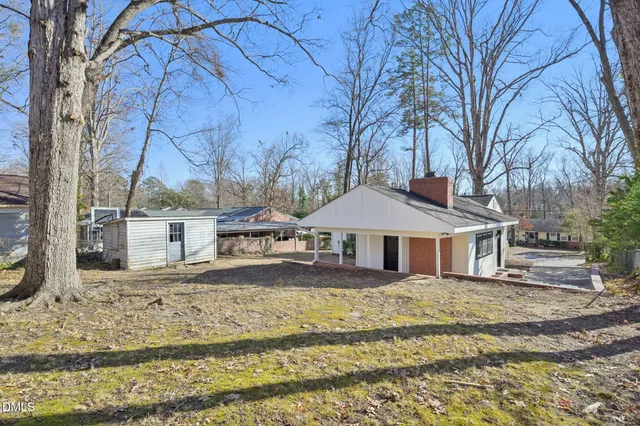 a view of a house with a snow in the yard