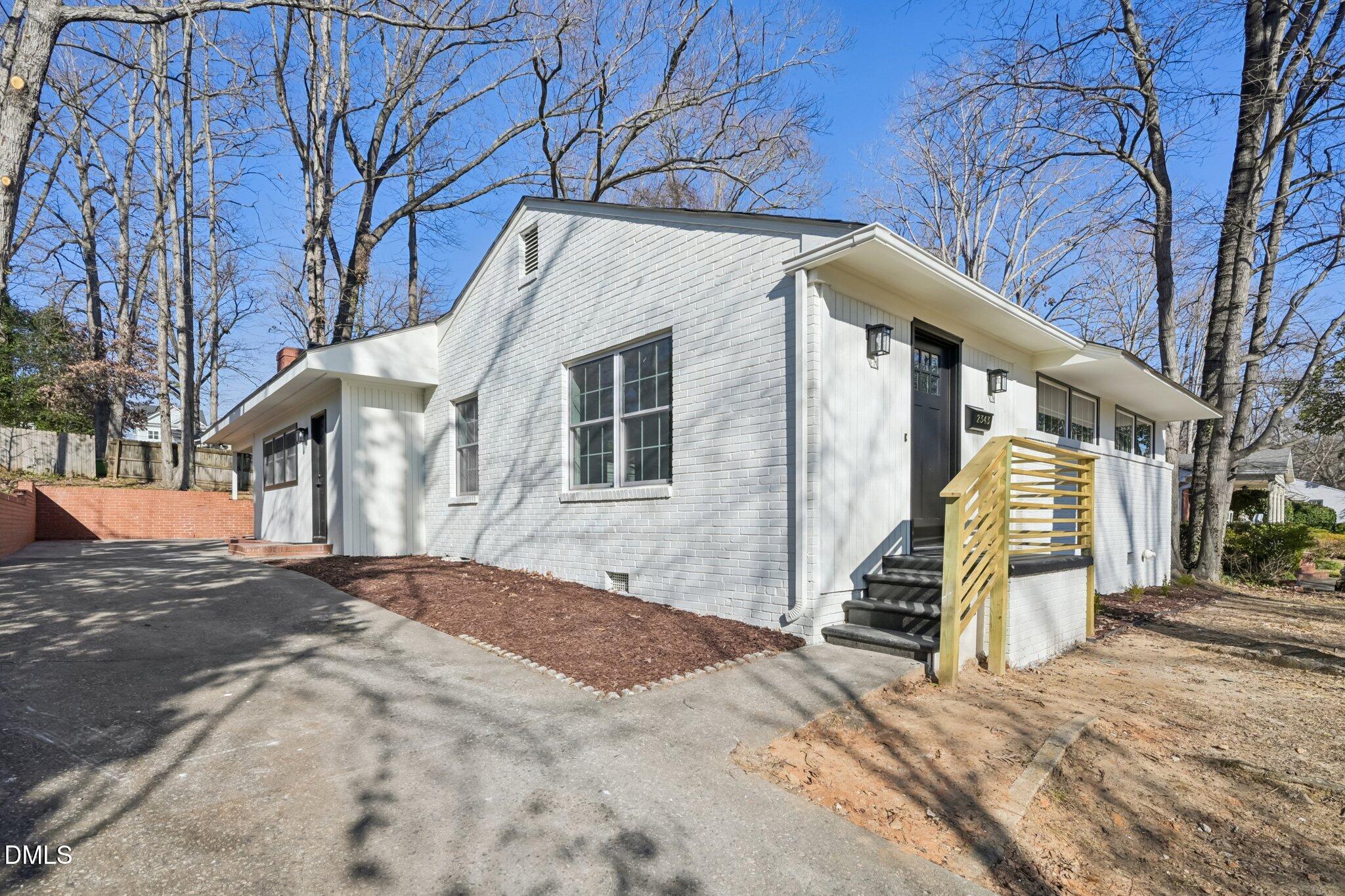 2343 Derby Drive Raleigh, NC 27610 - Photo 4 of 38 a view of a house with a snow on the road