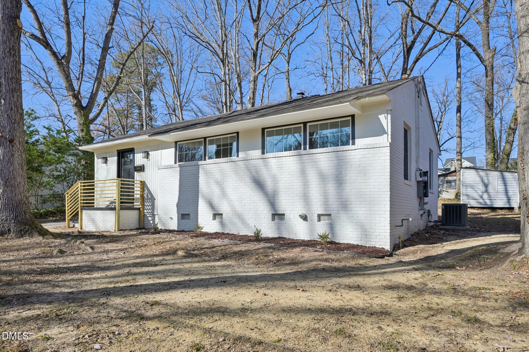 2343 Derby Drive Raleigh, NC 27610 - Photo 5 of 38 a view of a house with a bed
