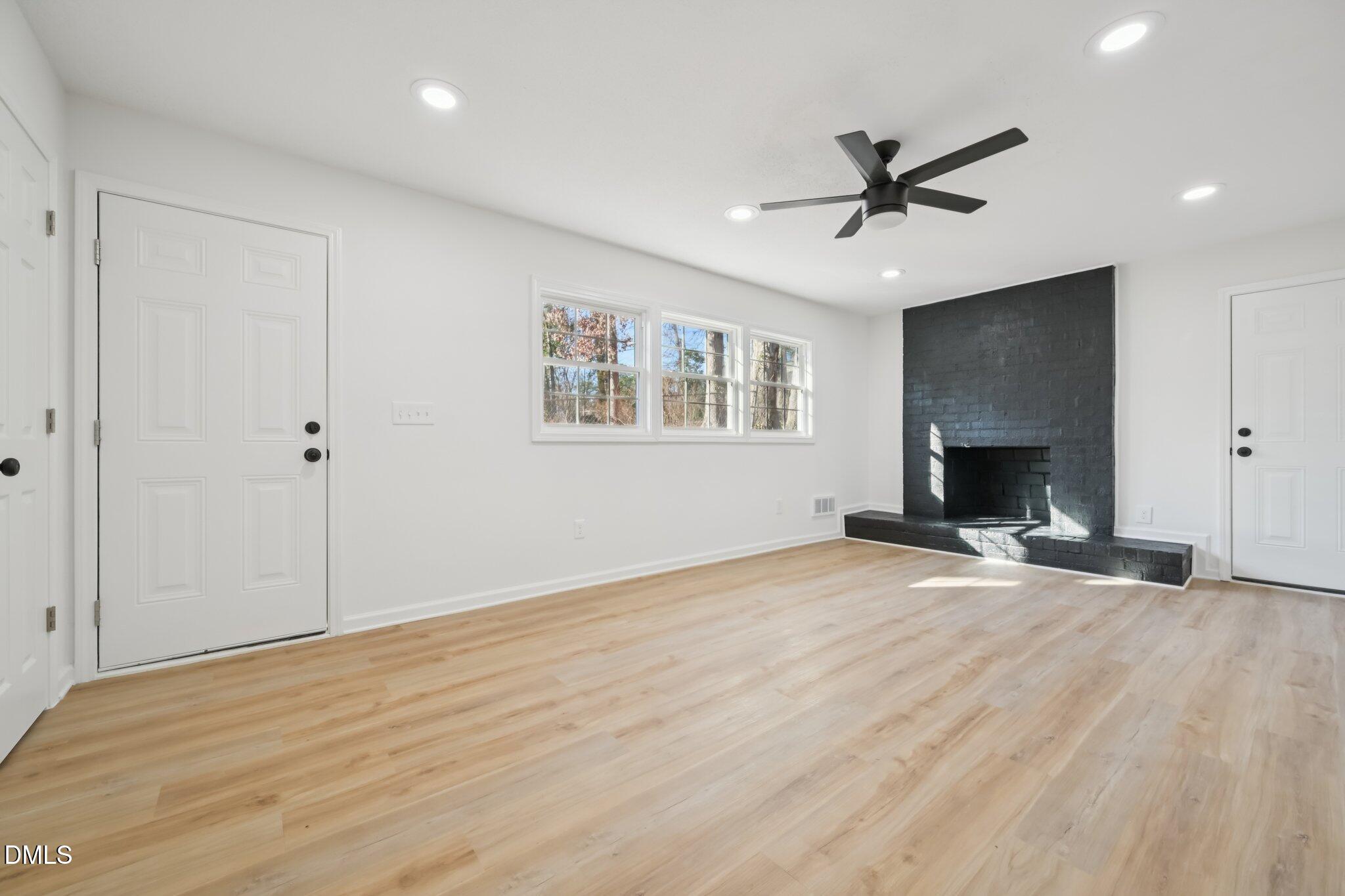 2343 Derby Drive Raleigh, NC 27610 - Photo 6 of 38 an empty room with fan and windows