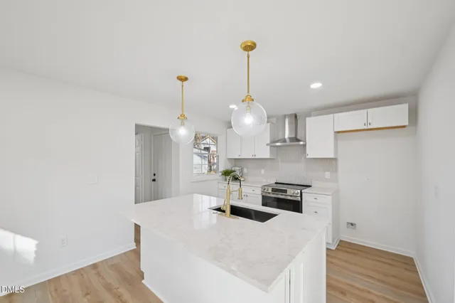 an empty room with fan and windows