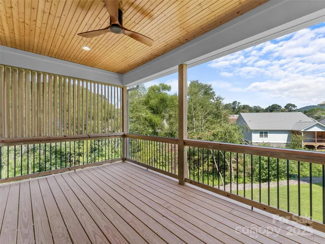a view of a balcony with wooden floor