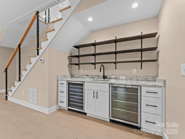 a kitchen with cabinets and window