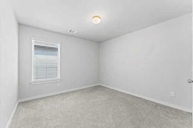 a bathroom with a sink a toilet and a large mirror