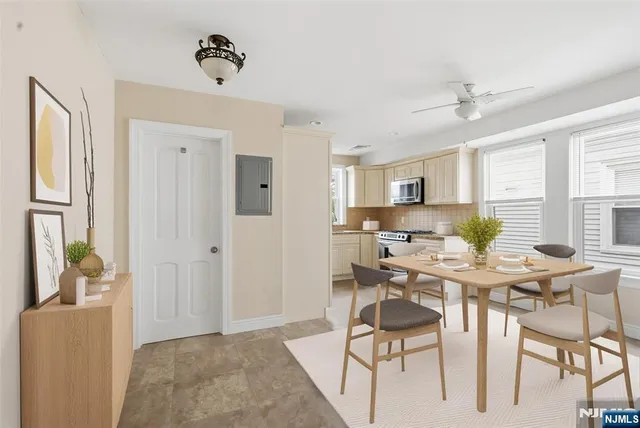a view of a dining room with furniture and window