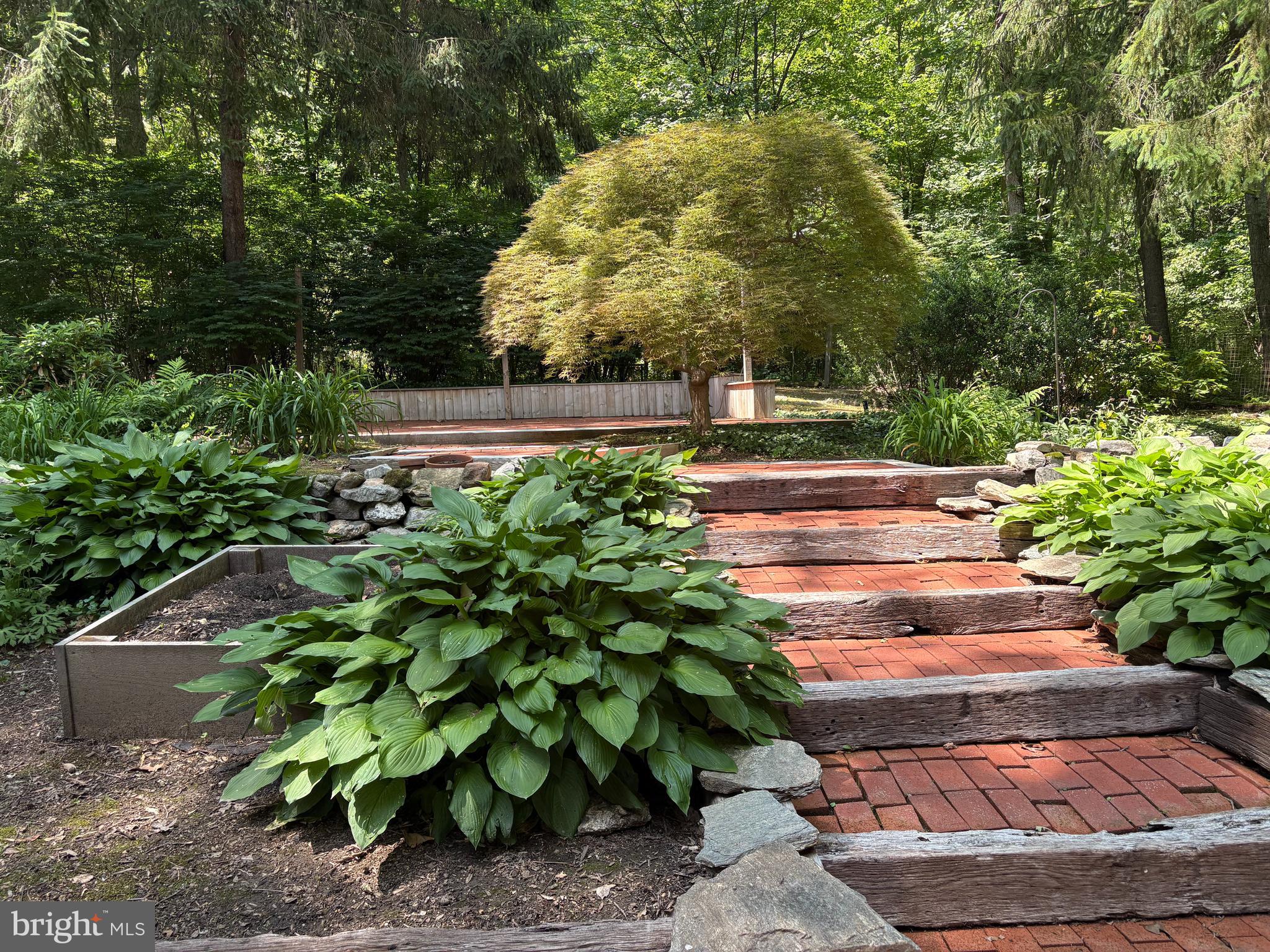 512 Conestoga Road Malvern, PA 19355 - Photo 14 of 33 Extensive landscaping in the rear yard