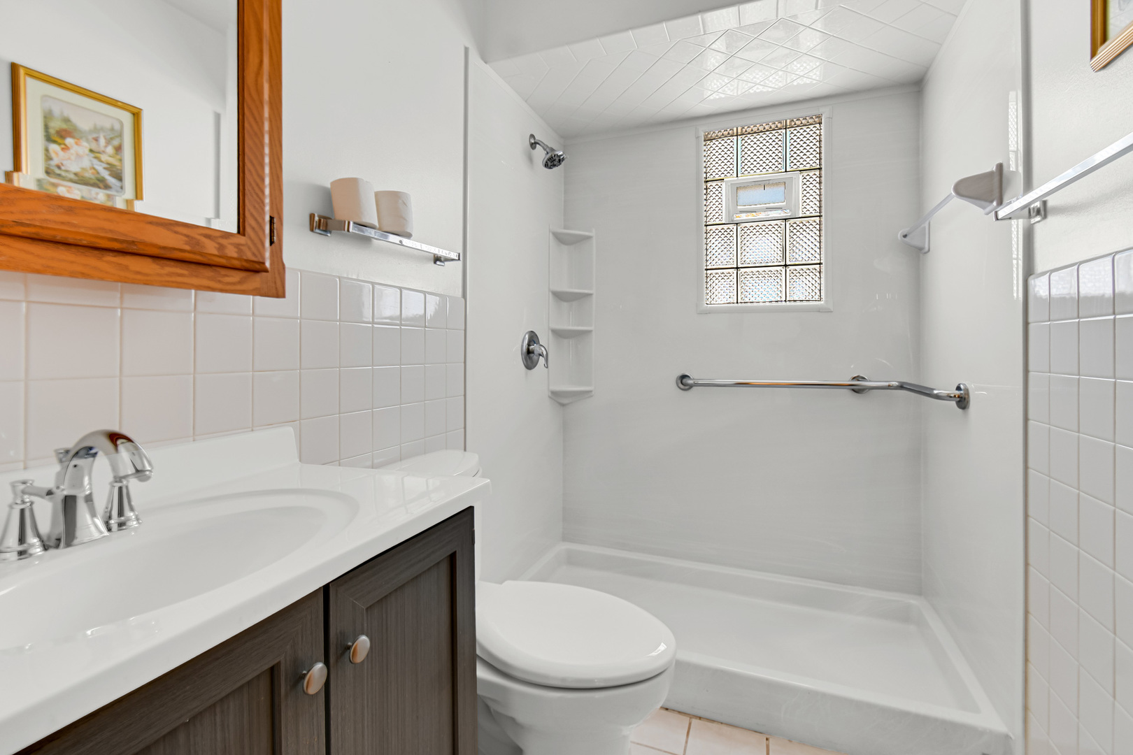 3346 Bernice Road Lansing, IL 60438 - Photo 15 of 24 a bathroom with a sink a toilet and shower