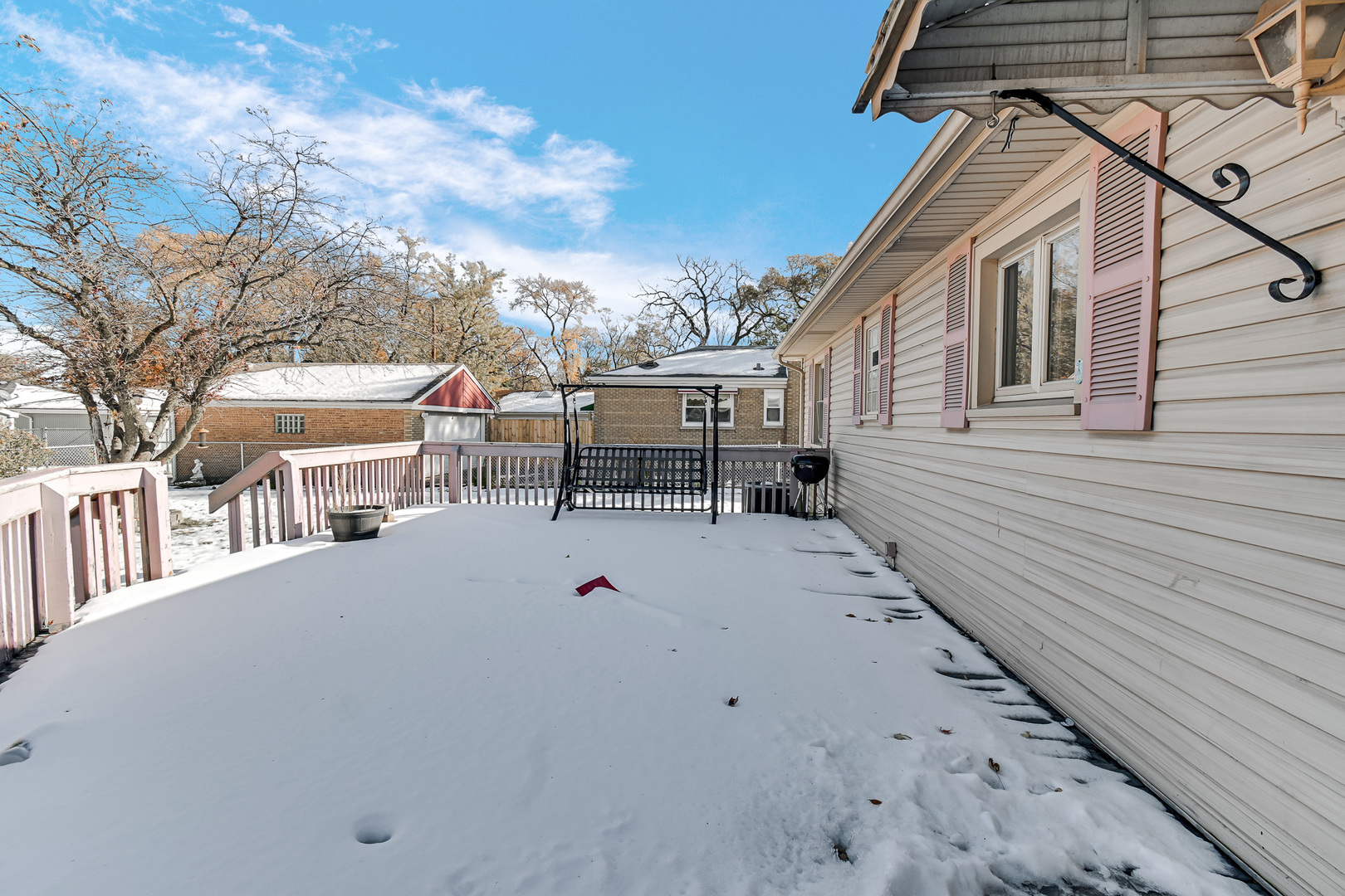3346 Bernice Road Lansing, IL 60438 - Photo 20 of 24 a view of a white house with a large window and table