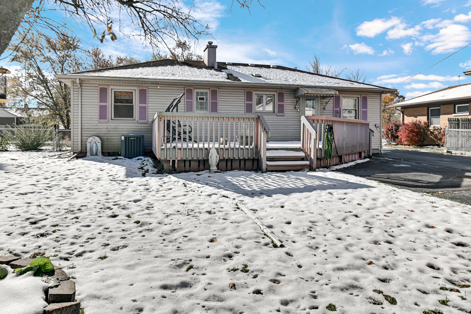 3346 Bernice Road Lansing, IL 60438 - Photo 22 of 24 a front view of a house with a wooden bench