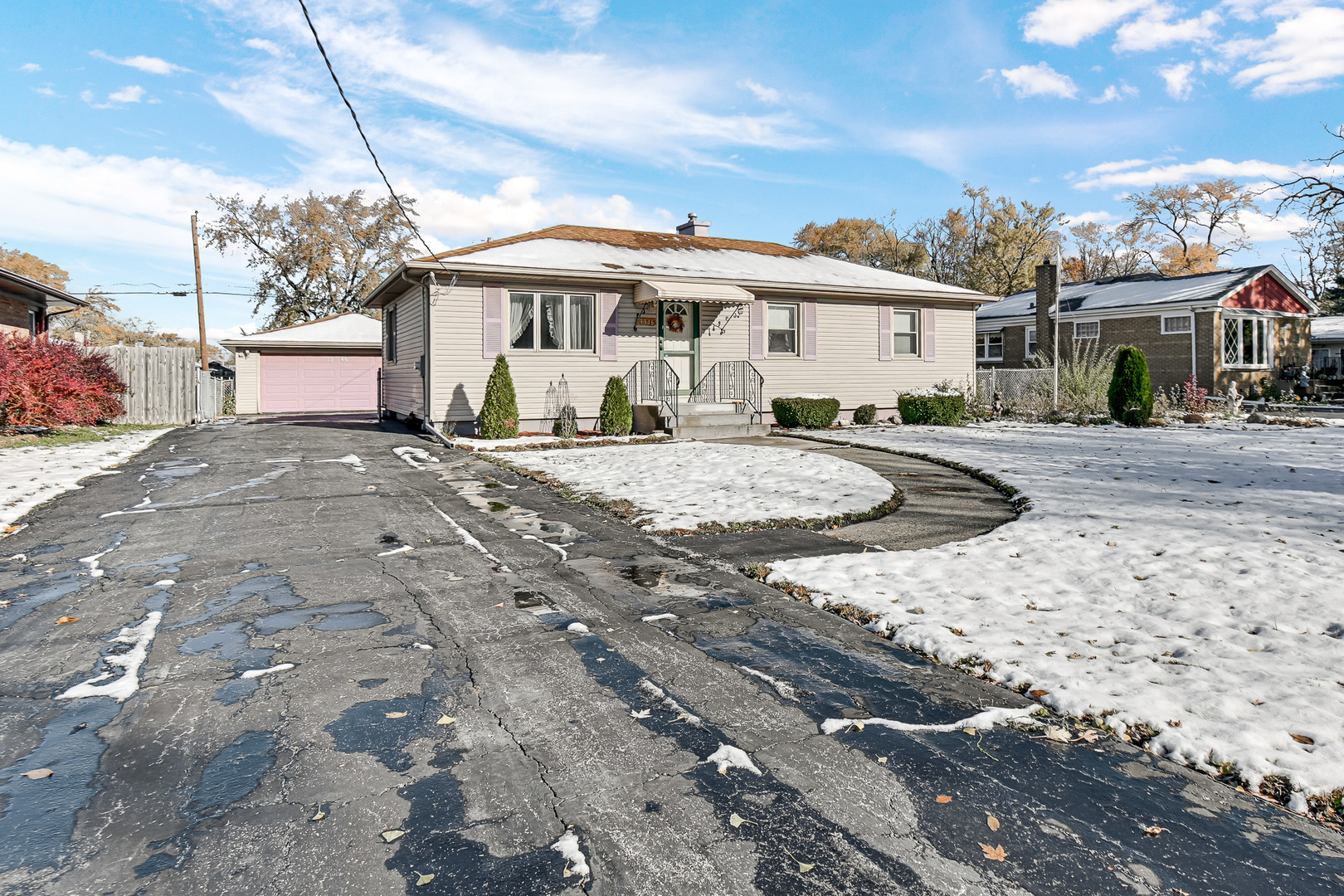3346 Bernice Road Lansing, IL 60438 - Photo 3 of 24 a front view of a house with a yard and garage