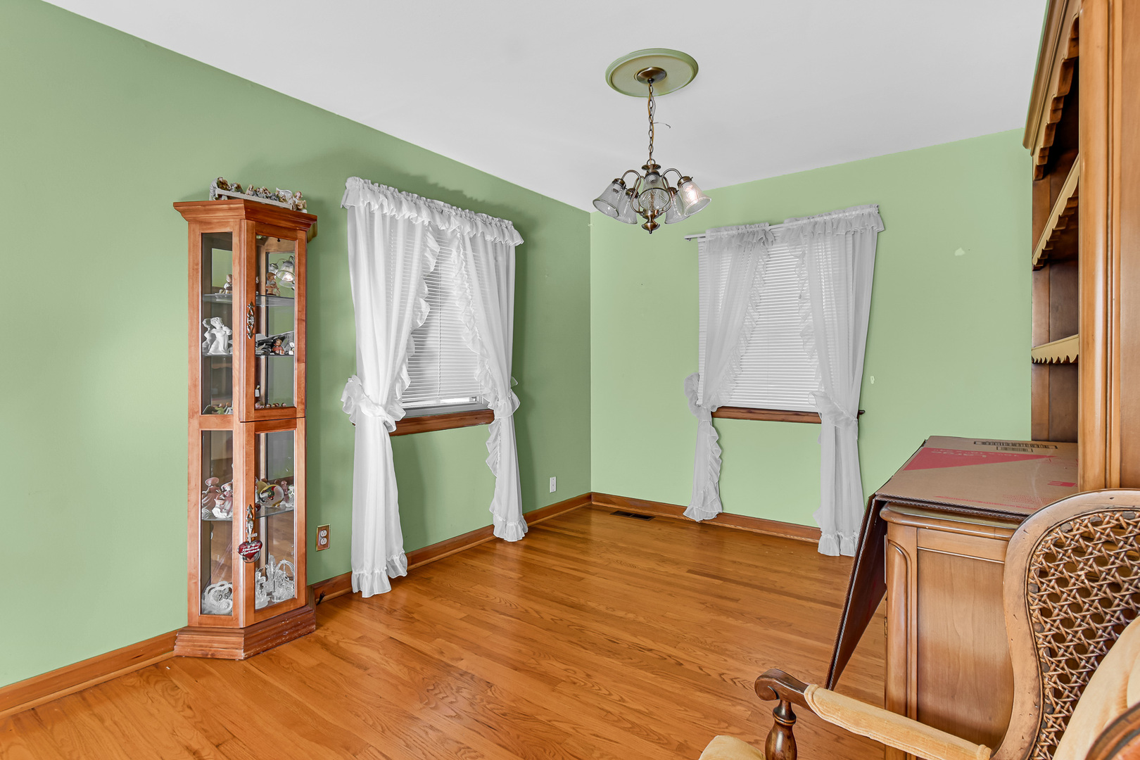 3346 Bernice Road Lansing, IL 60438 - Photo 4 of 24 a bedroom with a bed and a chandelier