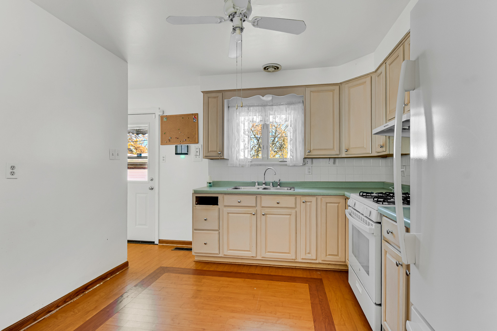 3346 Bernice Road Lansing, IL 60438 - Photo 5 of 24 a kitchen with stainless steel appliances granite countertop a sink and cabinets