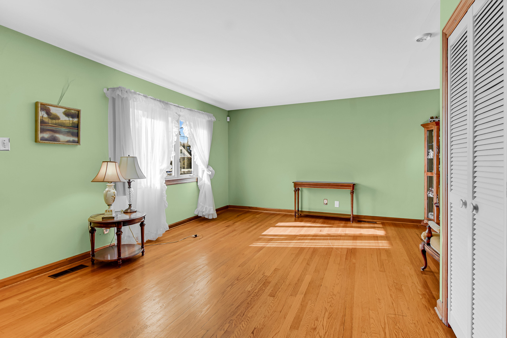 3346 Bernice Road Lansing, IL 60438 - Photo 7 of 24 a view of an empty room with window wooden floor