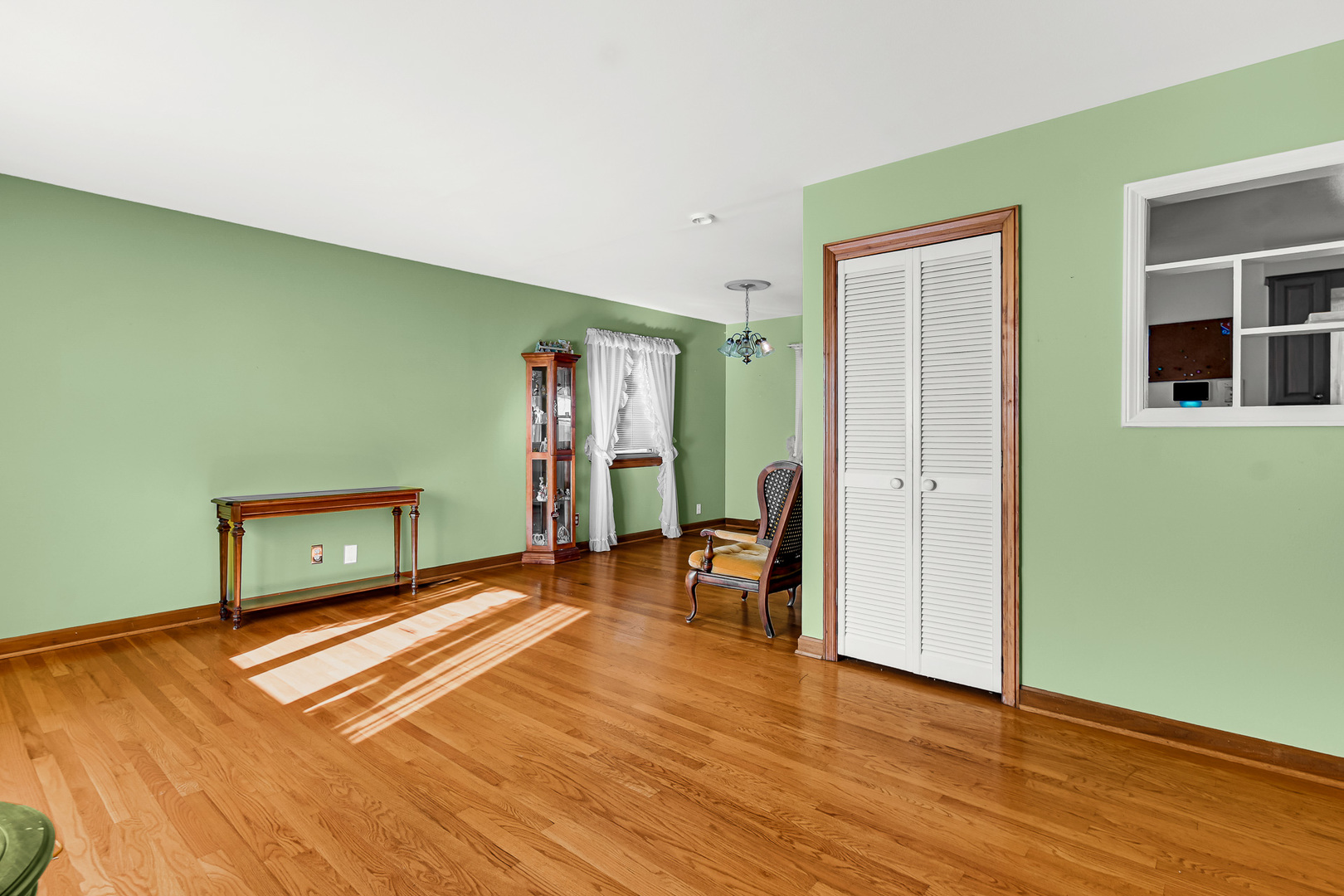 3346 Bernice Road Lansing, IL 60438 - Photo 8 of 24 wooden floor in an empty room with a window