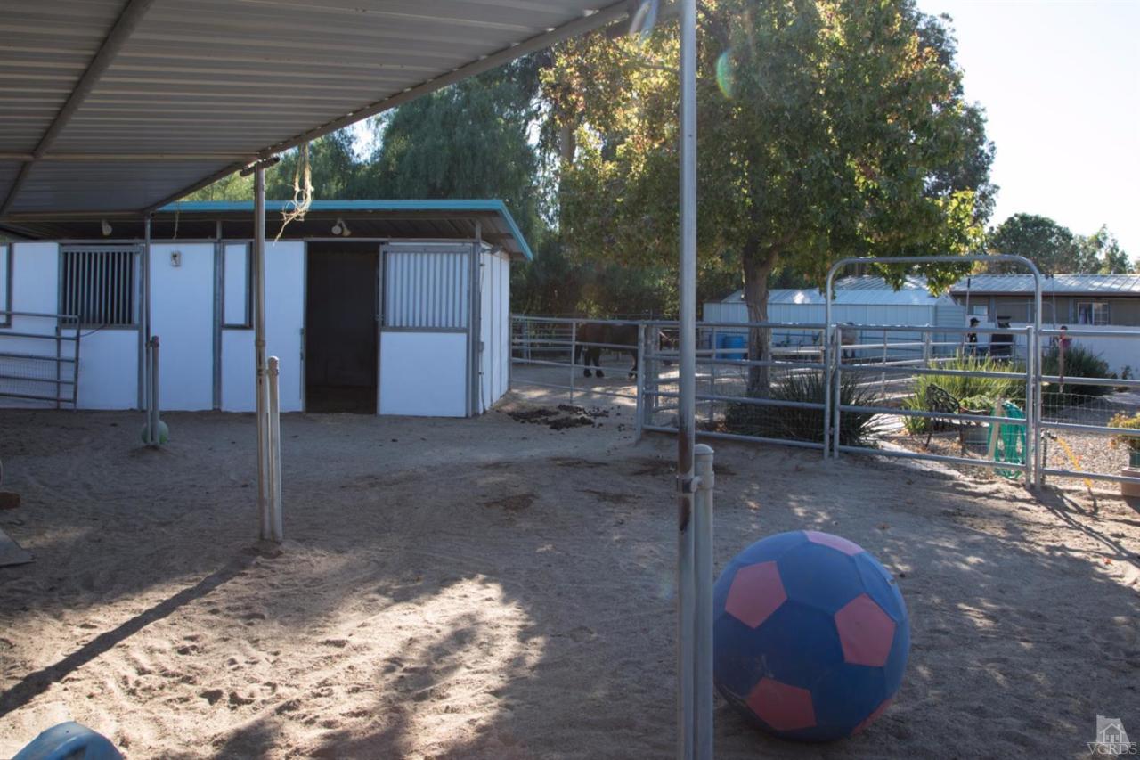 1774 Rambling Road Simi Valley, CA 93065 - Photo 22 of 24 a view of a backyard with wooden fence