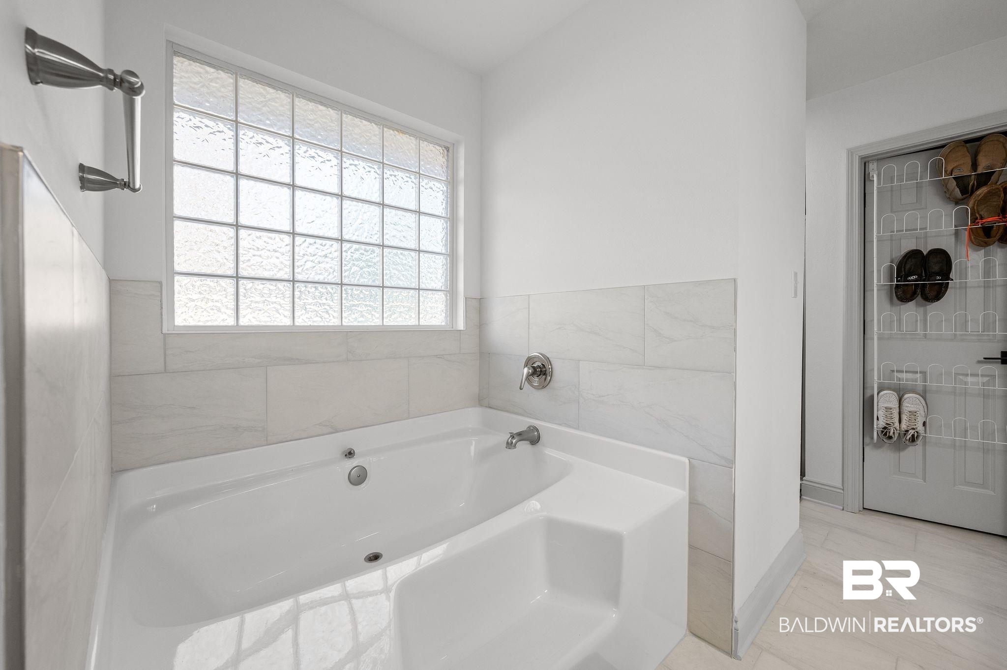 136 Destrehan Road Fairhope, AL 36532 - Photo 26 of 44 Bathroom with a tub to relax in, tile patterned floors, and plenty of natural light