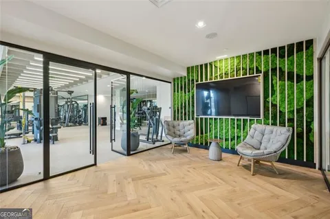a living room filled with furniture and a garden