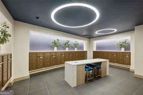 a kitchen with a sink and chandelier