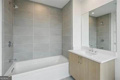 a bathroom with a bathtub and a sink