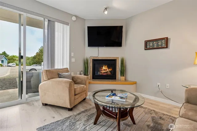 a bedroom with a bed and a table with mirror