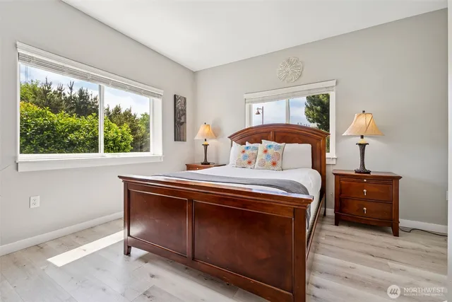 a bedroom with a flat screen television and a bed