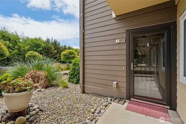 a view of a livingroom with furniture and a window
