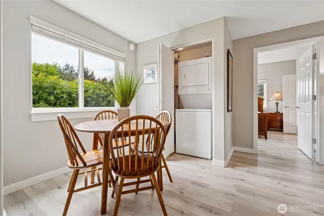 a kitchen with white cabinets and appliances